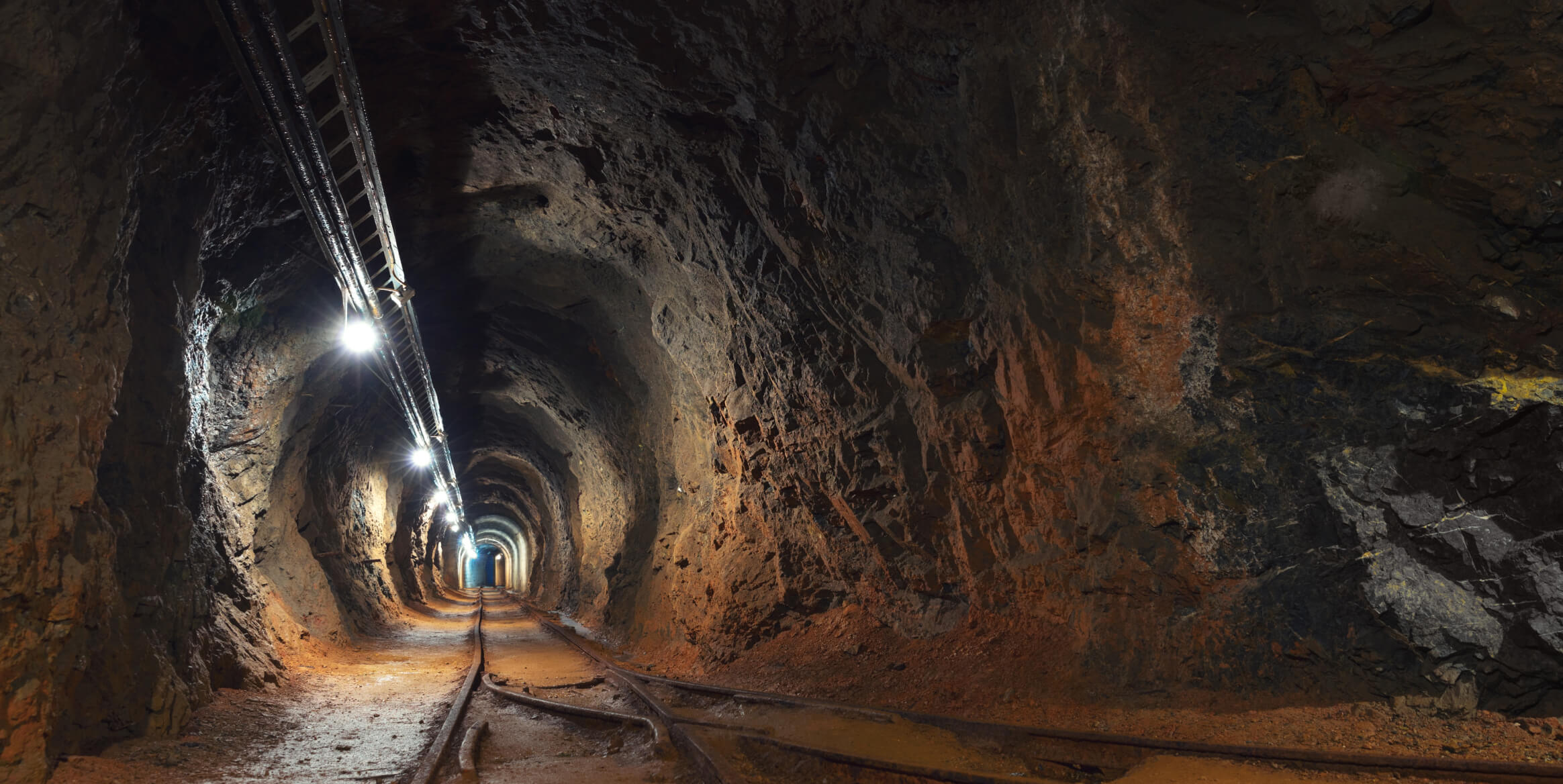 Underground mine with converging railway tracks.